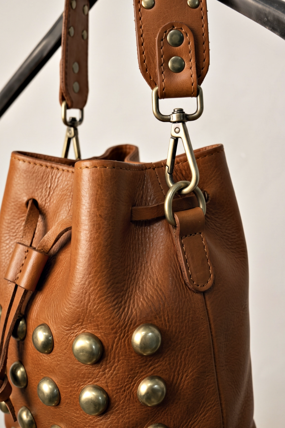 DOBELLE STUDDED LEATHER BUCKET BAG