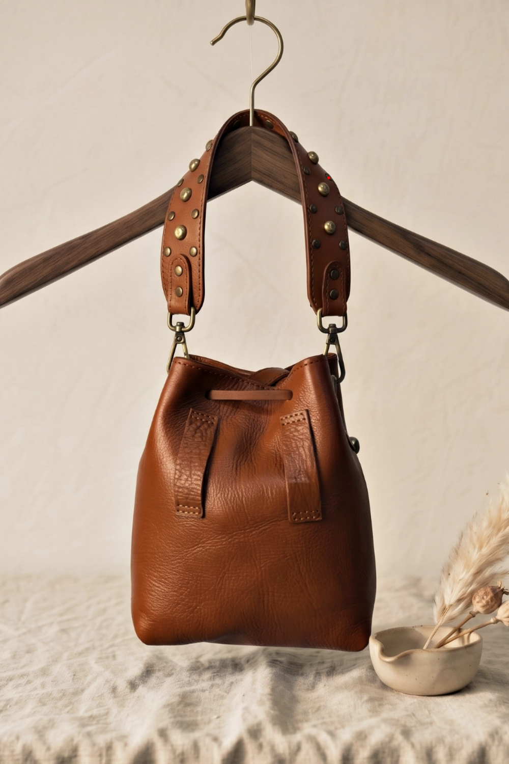 DOBELLE STUDDED LEATHER BUCKET BAG